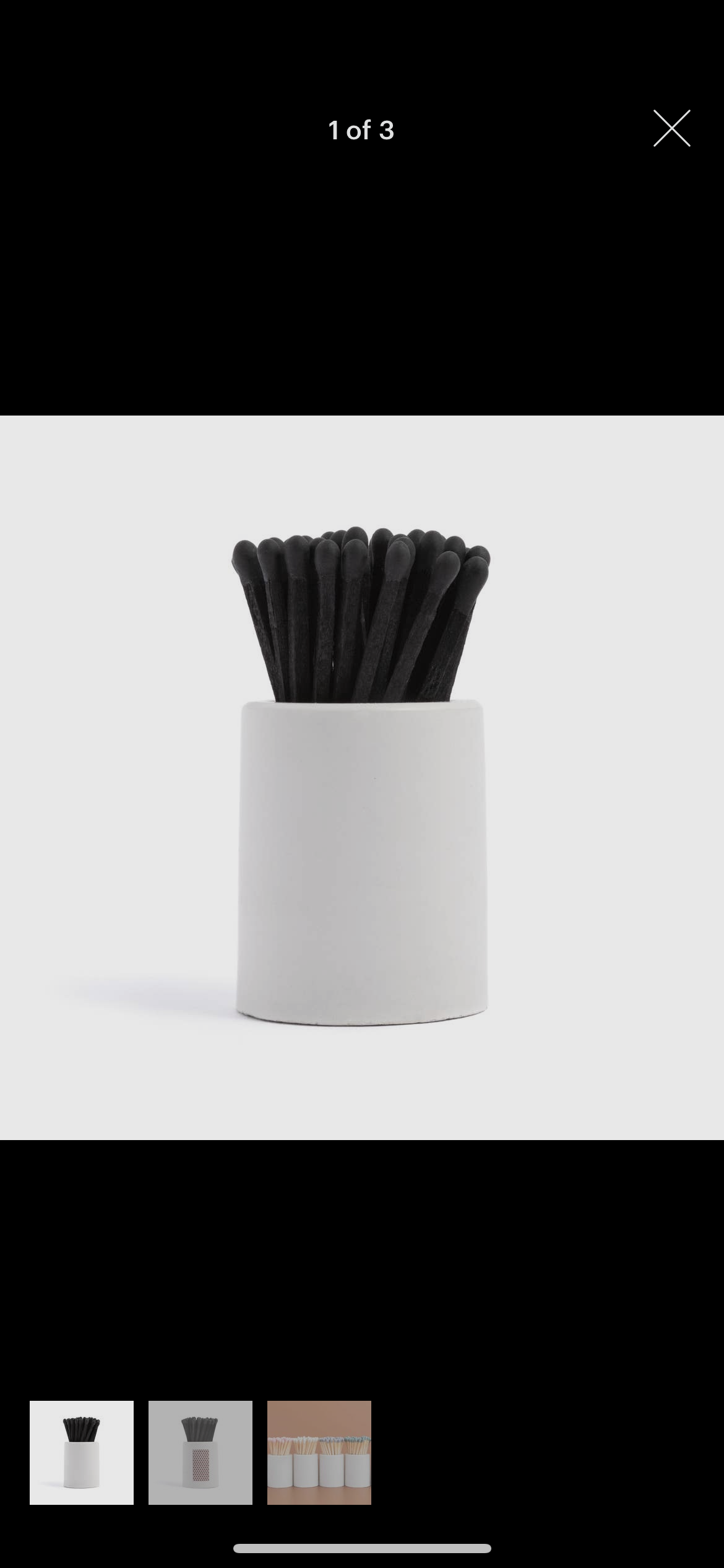 White Round Vessel with All Black Matchsticks is