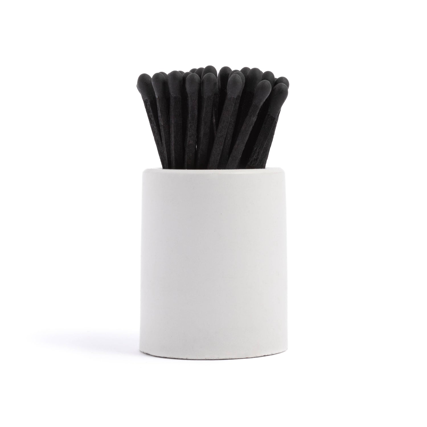 White Round Vessel with All Black Matchsticks is